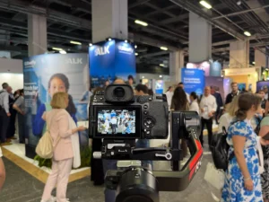 Photographer covering a corporate exhibition booth at an Istanbul trade fair
