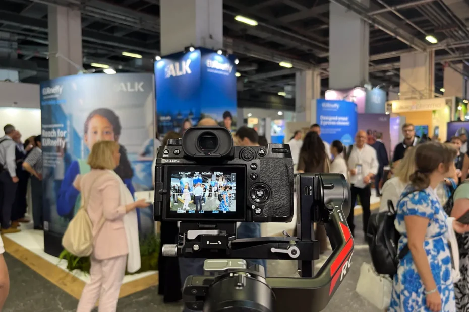 Photographer covering an exhibitor's booth at a defense and aerospace fair in Istanbul